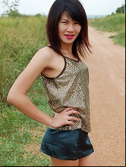Hung ladyboy Gold exposing her lean body outdoors