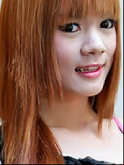 Fiery redheaded Asian tranny wanks and cums